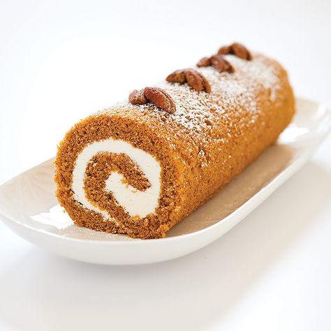 What’s orange and white and rolled all over? Our Pumpkin Roll pleases the taste buds and eyes with a whimsical swirl of cream cheese icing and soft, spiced sponge cake. Plus, we make the rolling easy with greased parchment paper. Pumpkin Yule Log, Pumpkin Jelly Roll, Pumpkin Jelly, Orange Sponge Cake, Jelly Roll Cake, Pumpkin Roll Cake, Pumpkin Rolls Recipe, Holiday Cake, Pumpkin Desserts