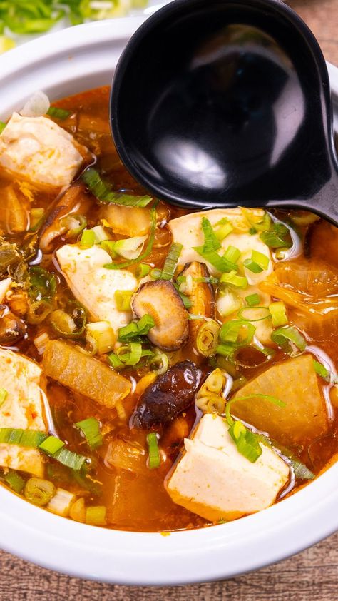 Korean tofu soup, also known as soondubu jjigae, is a classic Korean soup that comes together in less than 30-minutes and packs a punch of heat. Using soft or silken tofu and eggs provides protein, making this a fast and easy weeknight meal loaded with flavor. While the recipe calls for some ingredients that may be a little difficult to find, there are substitutions in the notes that may not be traditional but will still provide delicious results. Tofu And Eggs, Soft Tofu Soup, Korean Tofu Soup, Korean Dumpling, Korean Soup Recipes, Soondubu Jjigae, Jjigae Recipe, Korean Tofu, Korean Dumplings