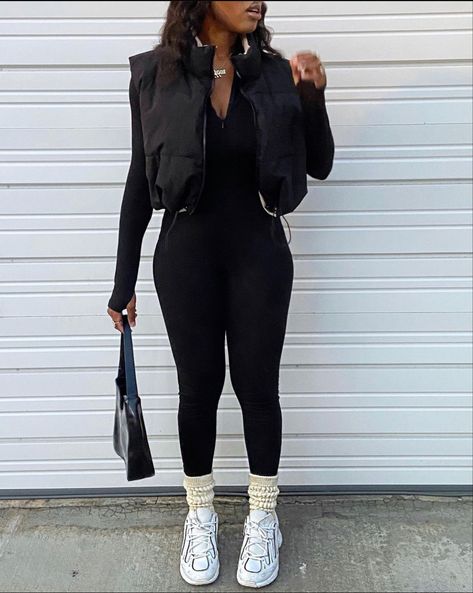 Black Gillet Outfits Aesthetic, Bodysuit Vest Outfit, Baddie Puffer Vest Outfits, Jumpsuit Vest Outfit, How To Style Full Bodysuit Outfit, Catsuit Outfit Casual, Black Full Bodysuit Outfit Winter, Black Body Warmer Outfit Women, How To Style A Catsuit