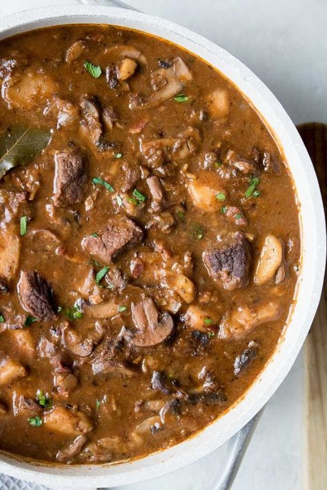 This hearty beef and mushroom stew recipe, complete with bacon, parsnips and red wine, is the perfect meal for a cold day. Beef Stew With Mushrooms, Beef And Mushroom Stew, Ground Beef Breakfast, Spaghetti With Ground Beef, Stew Beef, Chicken Shawarma Recipe, Mushroom Stew, Chicken Tikka Masala Recipes, Ground Beef And Potatoes