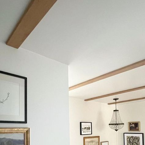 Erin Conway on Instagram: "Beams!! Well faux beams… kinda. We simply added wood planks to the ceiling to create the look of beams that are inset into the plaster. We live in a 1.5 story house and for some reason that equates to low hallway ceilings. We have done a TON of work to open up this area (swipe to see the view when we toured home). These “beams” were the missing component for me to help the illusion of height and to help add warmth. Swipe to third picture to see the space pre-beam." Low Profile Beams On Ceiling, Soffit Ceiling Ideas, Faux Beams Low Ceiling, Fake Beams Ceiling, Erin Conway, 1 5 Story House, 5 Story House, Fake Beam, Hallway Upstairs