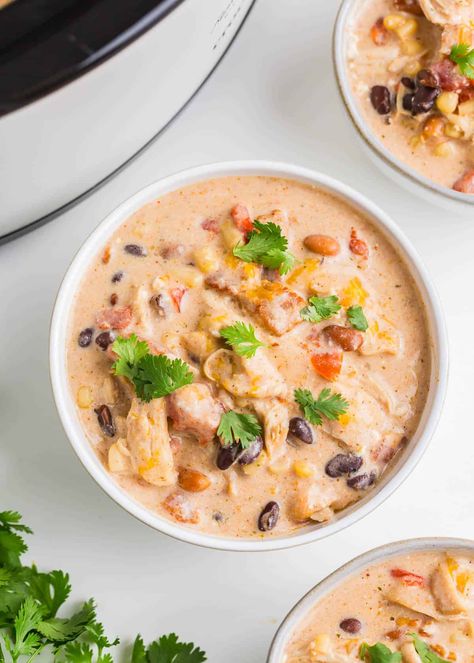 This crack chicken chili is made with juicy shredded chicken, bacon, ranch, and cheeses combined with beans, corn, and chili seasoning in one creamy, zesty, and hearty dish! Shredded Chicken Bacon Ranch, Juicy Shredded Chicken, Crockpot White Chicken Chili, Easy Taco Soup, Bbq Chicken Crockpot, Potato Soup Crock Pot, Easy Crockpot Chicken, Pre Cooked Chicken, I Heart Naptime