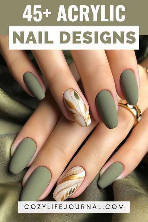 A hand displaying matte green acrylic nails with one accent nail featuring a white and gold leaf design, above text "45+ Acrylic Nail Designs" on cozylifejournal.com. Green Gel Manicure Ideas, Nail Designs Earth Tones, Green Manicure Ideas, Nail Design Green, Nail Ideas Green, Summer Green Nails, Trendy Nails Gel, Nail Art Vert, Green Nails Ideas