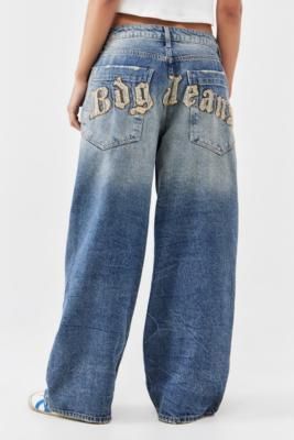 90s-inspired ultra-baggy jeans by BDG. In a washed denim with a relaxed fit and exaggerated detailing. Cut to a low waist, belt loops, button and zip closure and a signature five-pocket silhouette. Finished with tonal applique to the reverse. Only at UO. **About Recycled Content** \- We’ve used recycled content to help reduce the impacts of virgin resources on the environment, using third party certifications to verify our recycled fibres \- Recycled materials are taken from waste and reprocesse Denim Applique, Applique Jeans, Urban Outfitters Jeans, Bdg Jeans, 90s Inspired, Baggy Jeans, Vintage Denim, Denim Wash, Denim Jeans