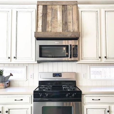 An oldie but a goodie! Do you have a microwave over your stove? Most of us do. This is the faux oven hood that Brad made to cover those hard-to-reach cabinets above the microwave. He didn’t have to remove anything—just built a frame and added our pallet wood. He did this at our previous home years ago, so we don’t have pics or a story tutorial...but hopefully this will give you an idea of what can be done in your home.  . . #DIY #fauxovenhood #farmhousekitchen #ovenhood #palletwood #woodto Kitchen Credenza, Oven Hood, Kitchen Vent Hood, Kitchen Vent, Build A Frame, Vent Hood, Kitchen Trends, Kitchen Redo, Painting Kitchen Cabinets