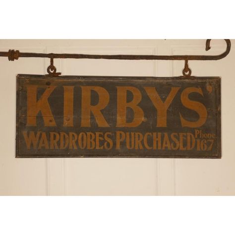 Edwardian wall hung shop sign, Kirbys’ wardrobes purchased A great piece of social history, this is a wooden sign painted on both sides and hanging on a blacksmith made Iron bracket, still in use in the 1930s when the phone number was squeezed in on the bottom line The sign is 39 x 12 inches, the overall size including the bracket is 49” x 20” Antique Signs Wood, Antique Signage, Antique Trade Sign, Vintage Inspired Signs, Wood Signage, Vintage Wooden Signs, Blade Sign, Cafe Shop Design, Sign Painting