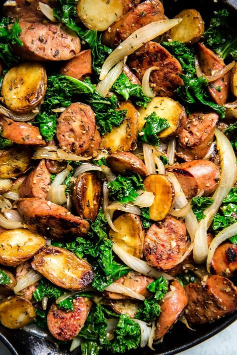 This recipe ticks all the boxes—a little meaty, some dark leafy greens, and some starchy goodness. An easy one-pan sausage, kale and potato skillet that pleases everyone, from cook to clean-up crew. Chicken Kale Sausage Recipes, Kale Potatoes And Sausage, Kale Lunch Recipes, Kielbasa And Kale Recipes, Kale Potato Recipes, Recipes Using Kale Dinners, Pork And Kale Recipes, Dark Green Vegetables Recipes, Dinner With Kale