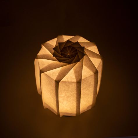 Frameless Japanese table lamp crafted with traditional Kyo-hyogu and origami techniques, featuring a unique illuminated origami pattern. Japan Lamp, Lamp Origami, Origami Light, Laser Cut Lamp, Origami Lantern, Origami Folds, Japanese Lighting, Origami Lights, Origami Table