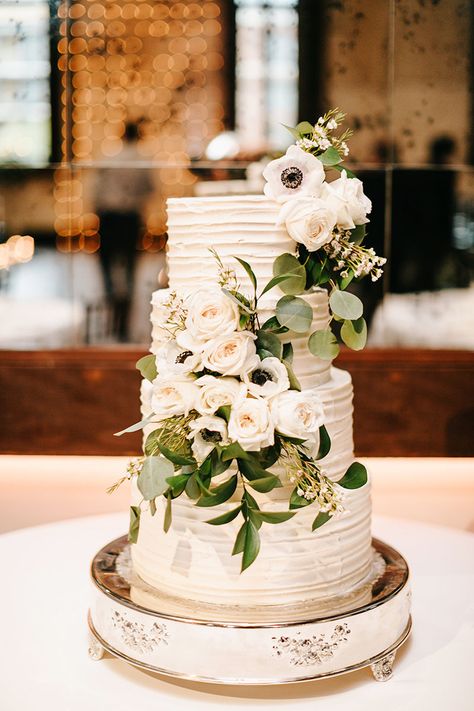 Elegant Four Tiered White Wedding Cake with Ivory Roses & Anemones Wedding Cake Ideas With Greenery, Wedding Cake With Anemones, White Roses Wedding Cake, Anemone Wedding Cake, Wedding Cake Anemone, Wedding Reception Cake Table, Champagne Wedding Cake, Fisherman Wedding, Timeless Fall Wedding