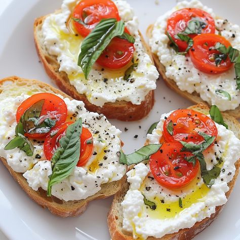 🍋🌿 Fresh and flavorful, these Lemon Basil Ricotta Crostini are a must-try! #Appetizers #FreshFlavors Lemon Basil Ricotta Crostini Ingredients: Baguette slices (12, toasted) Ricotta cheese (1 cup) Lemon zest (1 tsp) Fresh basil (1/4 cup, chopped) Olive oil (2 tbsp) Salt (to taste) Black pepper (to taste) Cherry tomatoes (1 cup, halved, optional) Instructions: In a bowl, mix ricotta cheese, lemon zest, fresh basil, salt, and pepper. Spread the ricotta mixture on toasted baguette slices. Dri... Guacamole Bruschetta, Toasted Baguette Slices, Fancy Toast, Ricotta Crostini, Baguette Slices, Ricotta Cheese Recipes, Basil Salt, Summer Appetizers Easy, Toasted Baguette