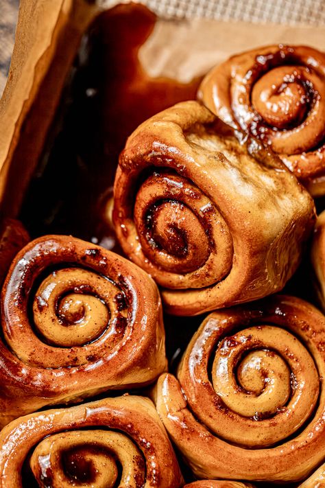 Sticky buns take on a whole new level of fall coziness with the pairing of maple & chai! They're made with an impossibly soft milk bread dough, filled with warm chai spices, and baked in a maple brown sugar goo. As they bake and then cool, the goo turns into a thick caramel-like sauce, giving them their signature sticky effect! Soft Milk Bread, Fall Coziness, Cross Buns Recipe, Sticky Buns Recipes, Chai Spices, Cardamom Buns, Hot Cross Buns Recipe, Maple Brown, Soft Milk