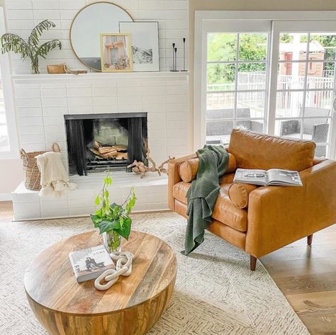 Mediterranean Sunroom, Scandinavian Outdoor Living, Built Ins Living Room, Angled Fireplace, Farmhouse Apartment Decor, Cozy Earthy Living Room, Tan Leather Armchair, Scandinavian Outdoor, Fireplace Styling