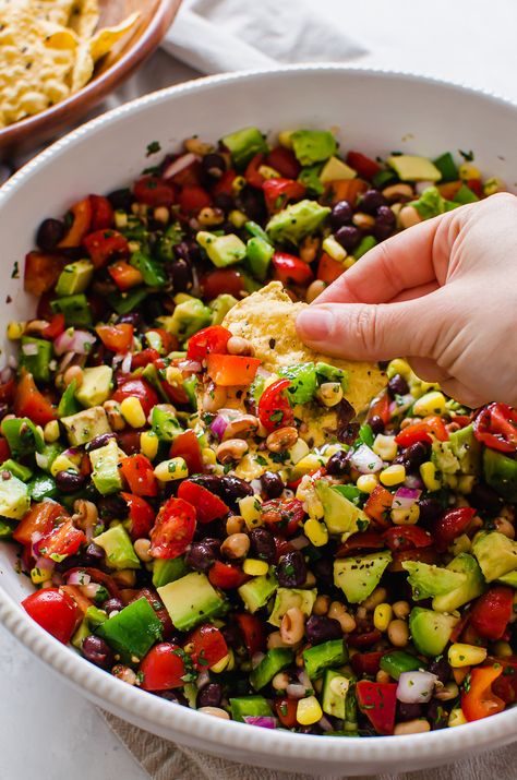 This fresh, delicious, and super healthy Fiesta Chopped Salad works as a light lunch, side dish, appetizer, or snack anytime. Make this on the weekend and eat on it throughout the week on its own or scoop it with tortilla chips or crackers. #salad #choppedsalad #cowboycaviar #healthy Salad With Beans, Bean Salad Healthy, Strawberry Avocado Salad, Fiesta Salad, Dairy Free Salads, Southwest Chicken Salad, Cowboy Caviar, Tilapia Recipes, Chopped Salad