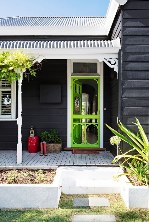 Is your front door in need of a quick facelift? A bold paint colour will give your home exterior a quick and inexpensive refresh. Read on for some fabulous front door colour ideas and inspiration. Dark Home Exterior, Dulux Exterior Paint, Weatherboard Exterior, Yellow Front Doors, Exterior House Renovation, Weatherboard House, House Colours, Cottage Renovation, Pintura Exterior