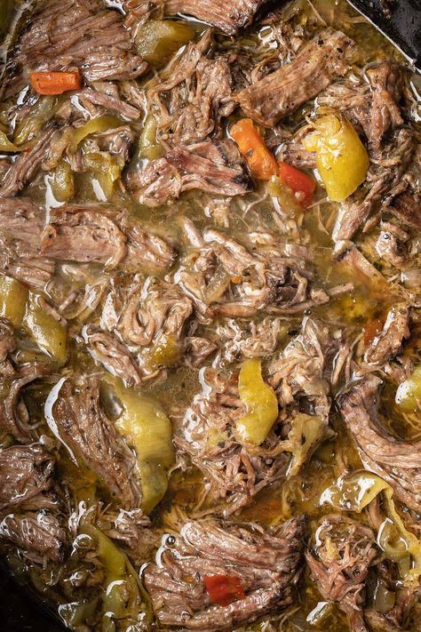 close up top view of shredded italian beef with pepeprs in crockpot Italian Beef Tips Crockpot, Italian Beef Crock Pot Recipes, Italian Beef With Pepperoncini, Italian Drip Beef Pioneer Woman, Italian Beef Dutch Oven, Italian Beef In Instapot, Rump Roast Italian Beef, Beef Stew With Pepperoncini, Venison Italian Beef