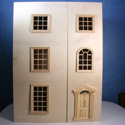 Two asymetric doors on the front of a baby house or bookcase, ready for final finish and trim. Bookcase Dollhouse, Dollhouse Woodworking Plans, Dollhouse Plans, Cardboard Box Houses, American Girl House, Baby Doll Furniture, Dollhouse Bookcase, Dollhouse Tutorials, Doll House Plans