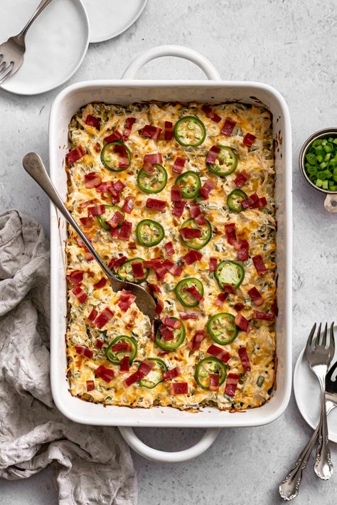 Your favorite appetizer just became a delicious dinner the whole family will love! This Healthy Jalapeño Popper Chicken Casserole is made with chicken, cream cheese, bacon, cauliflower rice, and packs 30g of protein per serving. Jalapeño Popper Chicken Casserole, Jalapeno Popper Casserole, Jalapeno Popper Chicken Casserole, Popper Chicken Casserole, Healthy Pasta Bake, Cauliflower Rice Casserole, 30g Of Protein, Healthy Chicken Casserole, Popper Chicken