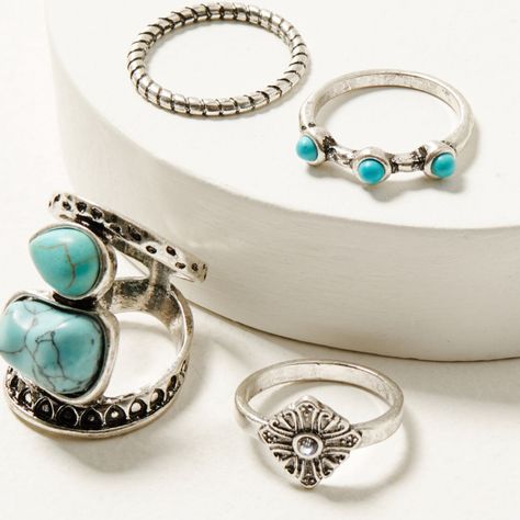 Product Details Set Includes 4 Rings Piece 1: Diamond Shape With Rhinestone Center And Painted Details Piece 2: Simple Band With 3 Turquoise Stone Accents Piece 3:Simple Roped Band With Painted Details Piece 4: Oversized Statement Ring With 2 Turquoise Pendants With Painted Details Silver-Toned Hardware Imported One Size Fits Most Western Jewelry Rings, Braided Ring Band, Turquoise Squash Blossom, Turquoise Gold Ring, Boot Barn, Arrow Ring, Gold Band Ring, Western Jewelry, Turquoise Rings