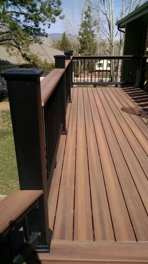 Discover the benefits and considerations of composite decking for your home. This comprehensive guide provides homeowners with valuable information on safety, eco-friendliness, and maintenance. Composite Deck With Wood Railing, Deck Patio Furniture Ideas, Timber Tech Deck Colors, Rustic Deck Ideas, Black Decking Ideas, Decking Colours Ideas, Timbertech Deck Ideas, Black Decking, Decking Colours