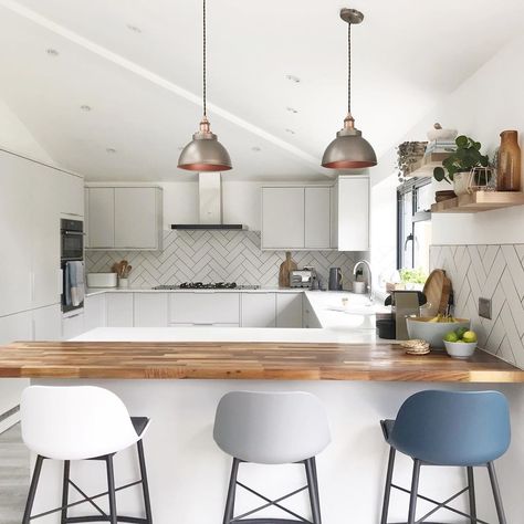 Create a modern kitchen design, just like @inside_no_23_, with our Greenwich Dove Grey kitchen cabinets. Create a breakfast bar everyone wants to sit at with wooden worktops, bar stools and statement pendant breakfast bar lighting. Add chevron style white metro tiles to add a modern design feature. Light Grey Bar Stools, Grey Kitchen With Breakfast Bar, White Kitchen With Breakfast Bar, White Kitchen Breakfast Bar, Light Over Breakfast Bar, Grey Kitchen White Tiles, Breakfast Bar Styling, Lights Over Breakfast Bar, Marble Breakfast Bar