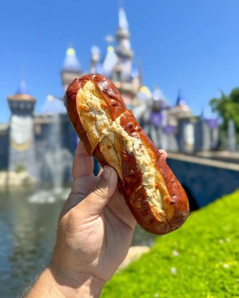 Foodatdisneyland on Instagram: "The Cheesy Garlic Pretzel Bread from Maurice’s Treats (Also available at Edelweiss Snacks) in Disneyland   $7.49  This pretzel bread is incredibly warm, soft, and cheesy. It’s a good size too for a snack. I really enjoyed it and think they could even up the amount of garlic or cheese in it if they wanted to. Has hit the spot every time. I’d say this is my personal savory snack in Disneyland right now. I like it with marinara, without marinara, and even have taken it over to Bengal Barbecue and added a beef skewer inside it. Definitely recommend.   #disneyland #foodatdisneyland #disneylandfood #disneysnacks #disneyparks #disneyeats #disneyfood #visitanaheim" Rich Besties, Disneyland Foods, Best Disneyland Food, Disney World Snacks, Disneyland Snacks, Carnival Eats, Disney Photoshoot, Disney Sweets, Pretzel Bread