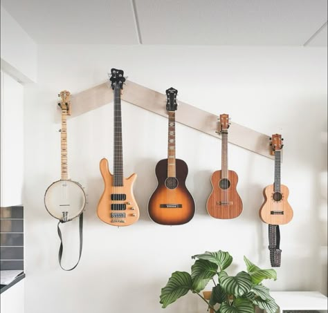 Musical Instruments Wall Decor, Instrument Display Wall, Guitar Wall Display Bedroom, Guitar Wall Bedroom, Hanging Instruments On Wall, Guitar Wall Hanger Ideas, Guitars On Wall Living Room, Music Room At Home, Instruments On Wall