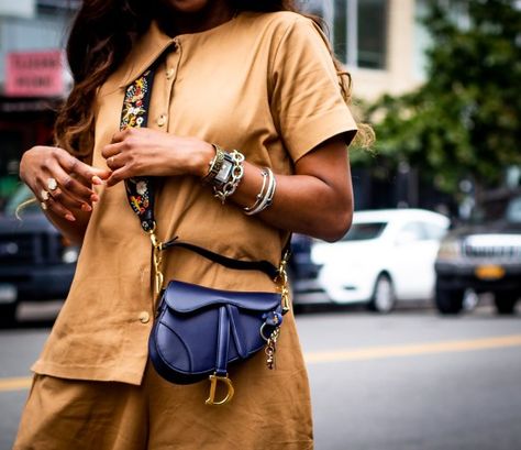 How to style the new Dior saddle bag and logo strap. Atlanta fashion and lifestyle blogger Monica Awe-Etuk wearing utility jumpsuit by FIA Factory, Chloe heart sunglasses, the new Dior Saddle bag, with logo strap, and white cult gaia mules Bucket Bags Outfit, Dior Outfit, Handbag Ideas, Dream Bag, Dream Bags, Atlanta Fashion, Utility Jumpsuit, Summer 19, Dior Saddle