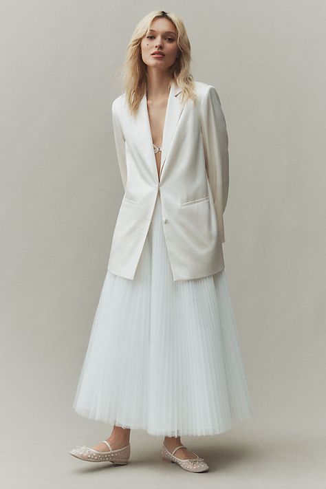 The Reformation Vera Satin Blazer exudes a bridal vibe with its elegant satin fabric and tailored silhouette, perfect for a modern bride. | Vera Satin Blazer Jacket by Reformation in White, Size: XL, Polyester/Acetate at Anthropologie Bridal Blazer And Skirt, Blazer With Wedding Dress, Bride In Pants, Nonbinary Wedding Attire, Wedding Blazer Women, Vogue Wedding Photography, White Dress With Jacket, Satin Dress With Jacket, Winter Wedding Jacket