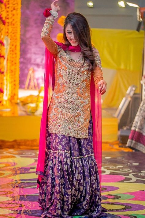 All you beautiful Brides to-be!! Check out this new silhouette which would look trendy, Chic and Gorgeous. A Brocade sharara like such would be an apt choice for your intimate wedding!! #indianwedding #shaadisaga #intimatewedding #sharara #bridalsuit #brocadesharara #shararasuit #bridalfashion #indianweddingfashion Pakistani Mehndi Dress, Gharara Designs, Mehndi Dress, Shadi Dresses, Mehendi Outfits, Pakistani Formal Dresses, Gaun Fashion, Pakistani Wedding Outfits, Pakistani Bridal Dresses