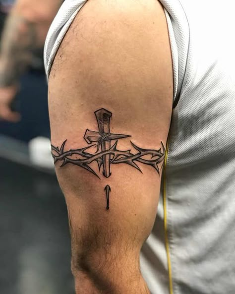 Learn the surprising barbed wire tattoo meaning before you get it on a body. As a bonus, we've added more than 60 unusual ideas for inspiration. Thorn Tattoo Men, Men Cross Tattoos, Christian Tattoos Men, Barbed Wire Tattoo, Men's Tattoo, Wire Tattoo, Thorn Tattoo, Barbed Wire Tattoos, Simple Arm Tattoos