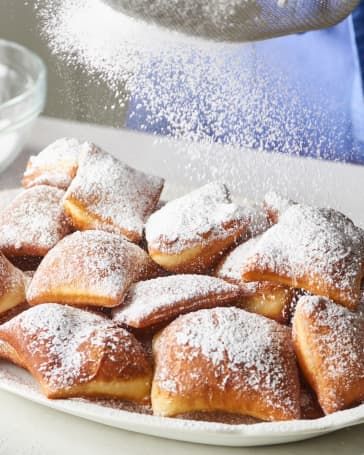 Easy Beignets Recipe | Kitchn Make Powdered Sugar, Beignet Recipe, Drop Biscuits, Hot Oil, Moist Cakes, Bread Dough, Beignets, Dry Yeast, Powdered Sugar