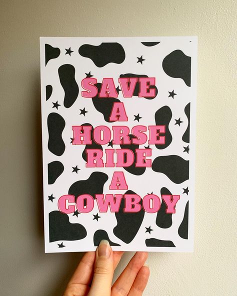 Wall gallery art print with a black and white cow print background and bold pink text reading, “Save A Horse Ride A Cowboy”. Design For Slogan Ideas Border Easy, Yee Haw Painting, Country Canvas Painting Easy, Country Things To Paint, Cowgirl Canvas Painting, Design For Slogan Ideas, Cowgirl Painting Ideas, Western Art Ideas, Cowboy Painting Ideas