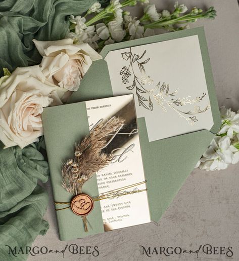 Announce your wedding in style with our Sage Green Mirror Gold Acrylic Wedding Invitations: Elegant Garden Wedding Cards with Pampas Grass. These invitations beautifully blend contemporary design with timeless elegance, making them perfect for your special day. Luxurious Mirror Gold Accents The standout feature of these invitations is the luxurious mirror gold accents. The mirror gold detailing adds a touch of opulence, catching the light beautifully and creating a stunning visual effect. This Sage Green Mirror, Boho Style Wedding Invitations, Acrylic Wedding Invites, Gold Wedding Invitations Elegant, Elegant Garden Wedding, Wedding Guest Book Table, Wedding Invitations Elegant, Wedding Invitations Uk, Passport Wedding Invitations