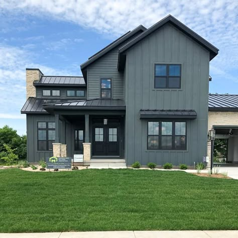 Dark Board and Batten House with Black Windows and Black Metal Roof Siding Color With Black Windows, Modern House White Windows, Light Color Exterior House Colors, Home With Black Windows, Dark Green House With Black Windows, Ranch With Black Windows, Black Window Exterior Color Schemes, Board And Batten With Metal Roof, Exterior Colors With Black Windows