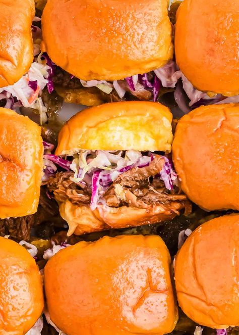 Make the ultimate BBQ pulled pork sliders with this easy pulled pork slider recipe! Tender pulled pork, topped with tangy coleslaw, all served on soft Hawaiian rolls, makes these sliders perfect for game days or parties. Whether you're using the slow cooker or Instant Pot, these pulled pork sliders come together effortlessly and will be a hit with any crowd. Slaw For Pork Sliders, Slow Cooker Pulled Pork Sliders, Bbq Hawaiian Roll Sliders, Pork Loin Sliders Hawaiian Rolls, Pulled Pork Sliders For A Crowd, Pulled Pork Hawaiian Rolls Sliders, Pulled Pork Slow Cooker Easy, Bbq Sliders Recipes Hawaiian Rolls, Pulled Pork Sliders Hawaiian Rolls