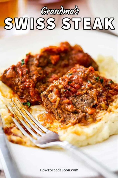 Grandma's Swiss Steak is old-school comfort food at its very best. Super tender meat with a deeply flavorful sauce. Grandma does it best! Get the complete recipe with ALL-NEW VIDEO on the blog!! Swiss Steaks, Smothered Steak, Swiss Steak Recipes, Round Steak Recipes, Swiss Steak, Best Mashed Potatoes, Cube Steak, With Mashed Potatoes, Homemade Dinner Rolls