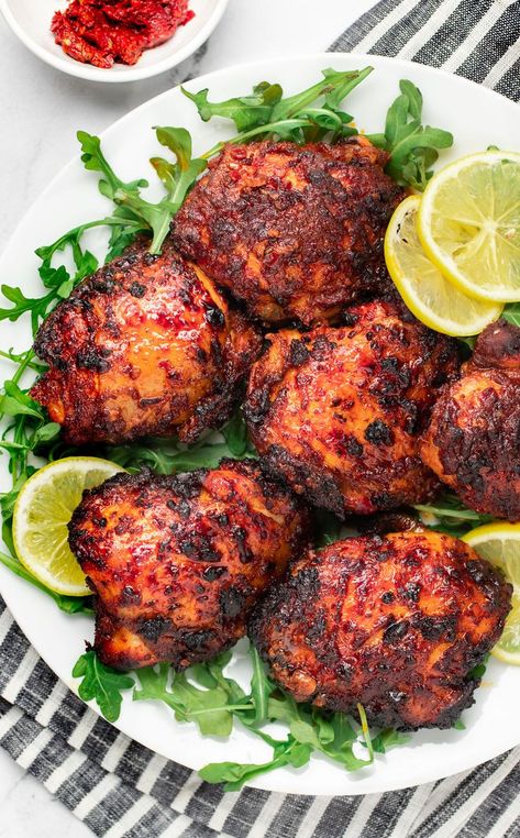 This Quick & Easy Harissa Chicken is the best 20-minute weeknight dinner! Chicken thighs are marinated in a quick no-fuss harissa marinade & roasted to perfection. The chicken becomes fall-part tender and soaks up all the sweet, rich flavours of the harissa marinade. It’s the perfect chicken recipe to accompany all your favourite sides. Easy, flavorful, versatile, & super fast thanks to the Air Fryer! Harissa Roast Chicken, Harissa Chicken Thighs, Harissa Chicken Marinade, Harissa Marinade, Dinner Chicken Thighs, Chicken Breast Air Fryer, Weeknight Dinner Chicken, Fish Tagine, Chicken Bake Recipe