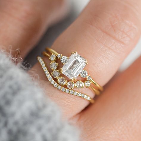 Two words we love: are shine and stunning. That's how we'd describe the beautiful emerald cut diamond engagement ring. Emerald Cut Engagement And Wedding Ring Sets, Emerald Engagement Ring With Band Gold, Emerald Cut Solitaire Engagement Ring With Wedding Band, Diamond Centerpiece, Handcrafted Engagement Ring, Melanie Casey, Timeless Engagement Ring, Emerald Cut Diamond Engagement Ring, Emerald Cut Engagement