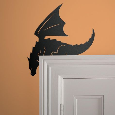 PRICES MAY VARY. Multiple sizes and colors available Premium 14-gauge American Steel that lasts Rust and UV resistant powder coat finish *Hanging components not included** A fun Dragon door topper! Great for your fantasy themed room or Dungeon's and Dragons Playroom. This Dragon also looks great on bookshelves, picture frames, mirrors, or anywhere creative you can think of! Hanging holes are not included on the product. We recommend using adhesive strips to secure item to the wall to avoid injur Fantasy Inspired Room Decor, Dragon Themed Nursery, Dragon Room Ideas, Mdf Jali Design, Dragon Bathroom, Dungeons And Dragons Room, Metal Door Frame, Dragon Decorations, Dragon Bedroom