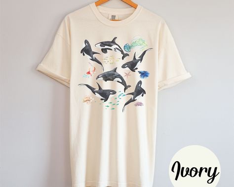 Orca Whale Comfort Colors Tee Comfort Colors garment-dyed t-shirt, made 100% with ring-spun cotton. The soft-washed, garment-dyed fabric brings extra coziness to your wardrobe while the relaxed fit makes it an excellent daily choice. These are Unisex fit tees, please make sure to check the size chart in the photos. *Returns* - All sales are final unless the item arrives damaged *Shipping* - Allow 3-7 business days for order to be processed and made - USPS shipping time is 3-5 business days - Double check shipping address is correct before placing order -We are not responsible for lost or stolen packages Orca Shirt, Aztec Clothing, Save The Whales, Orca Whale, Whale Shirt, Beach Tee, Orca Whales, Comfort Colors Tee, Ocean Animals