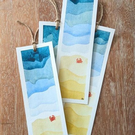 Beautiful hand painted bookmarks of the blue sea and golden sand with a fun little crab! Perfect gifts and painted with care. Each bookmark is unique as they are all originals, and may vary slightly in colour and design but the overall product will be the same. Finished off with twine to easily find your page in your book.  Average size - 6.5cm x 20.5cm (25cm with twine). Plain on the back. Free UK delivery. Watercolor Painting Easy Ideas, Sketch Bookmark, Book Mark Water Colour, Book Marks Painting, Paint Bookmarks, Water Colour Book Mark Ideas, Watercolour Bookmark Ideas, Easy Watercolor Bookmark Ideas, Watercolour Bookmarks Easy