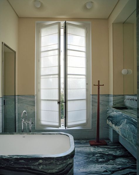 Lias stone defines the bath. Dornbracht tub filler. C. 1925 Jean-Michel Frank coatrack. Gray Streaks, Pierre Yovanovitch, Daybed Design, Paris Home, Oak Shelves, Marble Flooring, Bathroom Color, Parisian Apartment, Paris Apartments