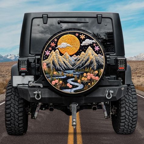 This spare tire cover with printed embroidery effect, featuring beautiful mountain landscape will protect your expensive spare tire against sun, wind, dust and water! And it will add a personal touch to the exterior of your car as well! Available with backup camera hole, or without it. NOTE. This is printed effect, the cover is not embroidered. The sides of the cover are black. Our spare tire covers are compatible with Jeep, with Bronco, with Toyota, as well as campers, RVs and trailers. See all Bronco Tire Cover, Camper Inspiration, Jeep Spare Tire Covers, Jeep Art, Jeep Things, Jeep Tire Cover, Cars Jeep, Car Things, Tiny Camper