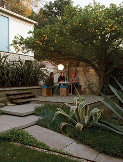 Surrounded by flax, agaves, and a prolific lemon tree, the gravel terrace out front makes an inviting place to eat, work, or party. Molina and Turin fashioned the table from repurposed glass and Unistrut tube steel and the humble chairs from plywood wrapped in sheets of blue foam. Echo Chamber, Citrus Trees, Outdoor Rooms, Outdoor Design, Modern Garden, Dream Garden, Backyard Garden, Garden Inspiration, Patio Garden