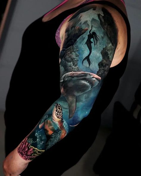 Get ready to dive into the world of shark tattoos and discover their unique symbolism and style. We invite you to learn more about their meaning, as well as choose a design that's right for you. The Sea Tattoo Ideas, Under The Sea Tattoo Ideas, Under The Sea Tattoo, Sea Tattoo Ideas, The Sea Tattoo, Sea Tattoo Sleeve, Ocean Theme Tattoos, Ocean Sleeve Tattoos, Ocean Sleeve