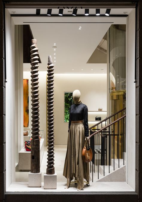 Casa Loewe wood-screw poles Loewe Store, Store Lighting, Metal Light Fixture, Wood Store, Lighting Concepts, Spring 2025, Miami Design, Creative Lighting, Design District