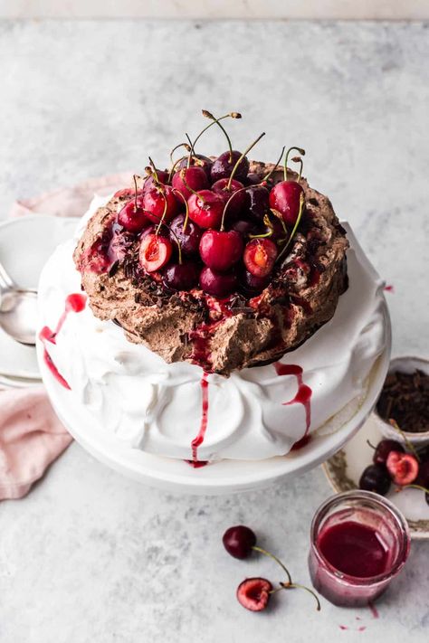 Black Forest Pavlova combines billowy meringue, chocolate whipped cream, fresh cherries and drizzled with cherry syrup. It's a delightful show-stopping dessert perfect for all special occasions! By Emma Duckworth Bakes. Black Forest Pavlova, Pavlova Chocolate, Cherry Pavlova, Cherry Syrup, Cherry Sauce, Cream Fresh, Chocolate Whipped Cream, Chocolate Swirl, Christmas Dessert