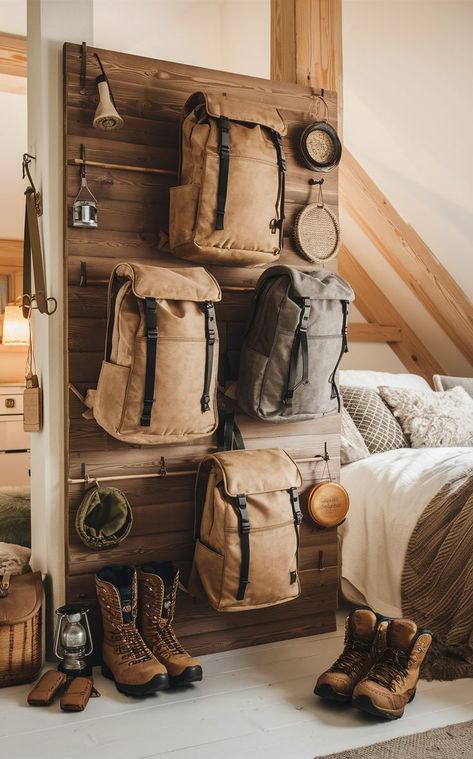 A rustic bedroom featuring a wooden backpacking gear wall with natural-toned backpacks and gear. Hiking Room Ideas, Gear Room Ideas, Gear Wall, Gear Room, Storage Bedroom, Storage Idea, Misty Mountain, Backpacking Gear, Backpack Storage