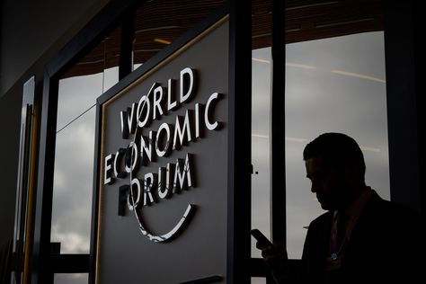 Chilling Davos: A Bleak Warning on Global Division and Debt World Economic Forum Davos, Davos, World Economic Forum, The New York Times, Ny Times, New York Times, Travel Posters, Tech Company Logos