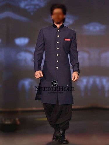 Stylish velvet collar Shahrukh Khan sherwani outfit in navy blue color Make any event cheerful with this Bollywood celebrity Shahrukh Khan sherwani suit Shahrukh Khan Sherwani, Navy Blue Sherwani, Party Dresses Pakistani, Pakistani Engagement Dresses, Indian Formal Dresses, Pakistani Engagement, Fashion Outfits Indian, Indian Wedding Sherwani, Kids Sherwani